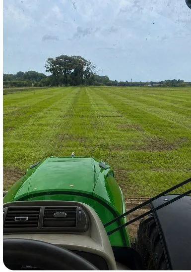 Tractor in a freshly cut field after vegetation clearance