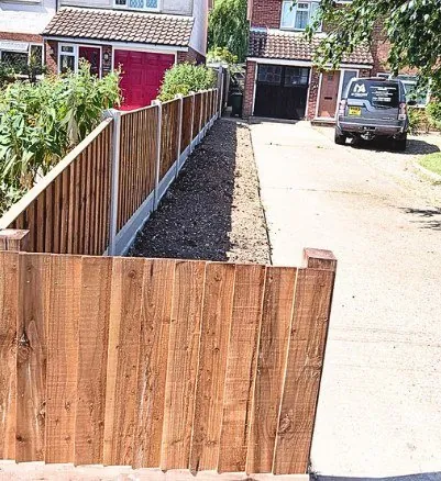 Cleared side passage with new close board fence along the driveway